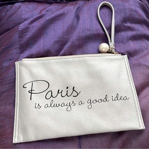 Metallic silver wristlet with faux pearl zipper detail